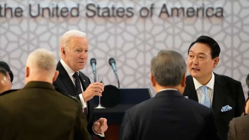 U.S. President Joe Biden, left, and South Korean President Yoon Suk Yeol toast at the start of a state dinner at the National Museum of Korea, in Seoul, South Korea, Saturday, May 21, 2022. (AP Photo/Lee Jin-man, Pool)