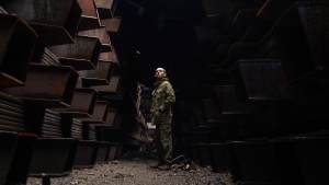 In this photo provided by Azov Special Forces Regiment of the Ukrainian National Guard Press Office, a Ukrainian soldier stands inside the ruined Azovstal steel plant prior to surrender to the Russian forces in Mariupol, Ukraine, May 19, 2022.
