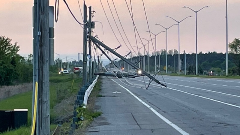 Downed hydro poles on Woodroffe Avenue. A major storm blew across Ottawa with wind gusts up to 120 km/h May 21, 2022. (Peter Szperling/CTV News Ottawa)