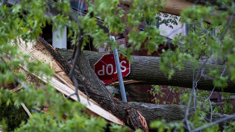 A stop sign is damaged after a tree fell on it during a major storm in Ottawa on Saturday, May 21, 2022. THE CANADIAN PRESS/Justin Tang