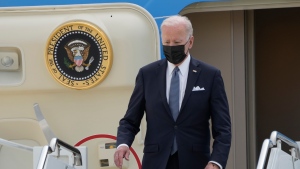 U.S. President Joe Biden, disembarks from Air Force One on his arrival at the U.S. Yokota Air Base, in Fussa on the outskirts of Tokyo, Sunday, May 22, 2022. (AP Photo/Eugene Hoshiko)