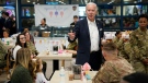 U.S. President Joe Biden, centre, meets with American service members and their family at Osan Air Base, Sunday, May 22, 2022, in Pyeongtaek, South Korea. (AP Photo/Evan Vucci)