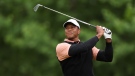 Woods plays his shot from the 14th tee during the third round of the 2022 PGA Championship. (Christian Petersen/Getty Images/CNN)