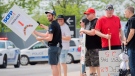 Croupiers protest outside the Casino in Montreal, Saturday, May 21, 2022, where they launched an unlimited general strike. THE CANADIAN PRESS/Graham Hughes