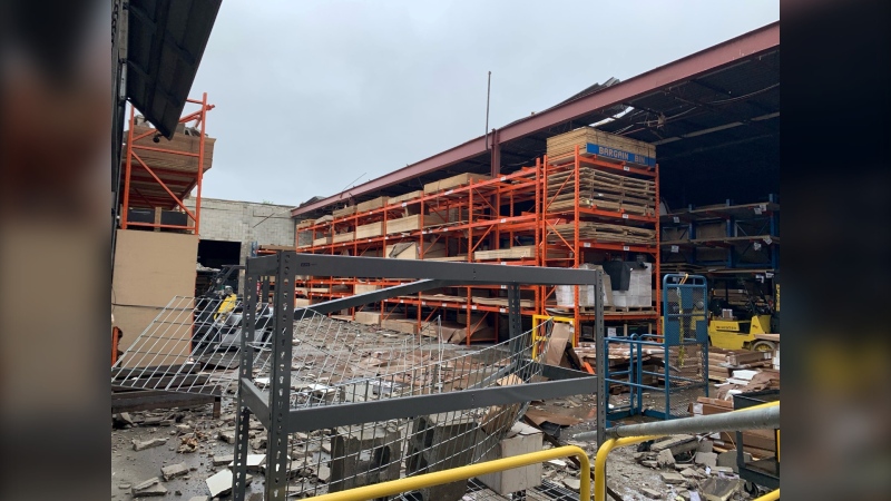 The warehouse of Commonwealth Plywood in London, Ont. is missing its roof Sunday after a powerful thunderstorm tore through the region on May 21, 2022. (Brent Lale/CTV News London)