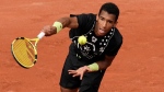 Canada's Felix Auger-Aliassime serves against Peru's Juan Pablo Varillas during their first round match at the French Open tennis tournament in Roland Garros stadium in Paris, France, Sunday, May 22, 2022. (AP Photo/Christophe Ena)