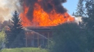 This photo submitted by Joel Levy shows flames engulfing the roof of the Quaaout Lodge near Chase, B.C.