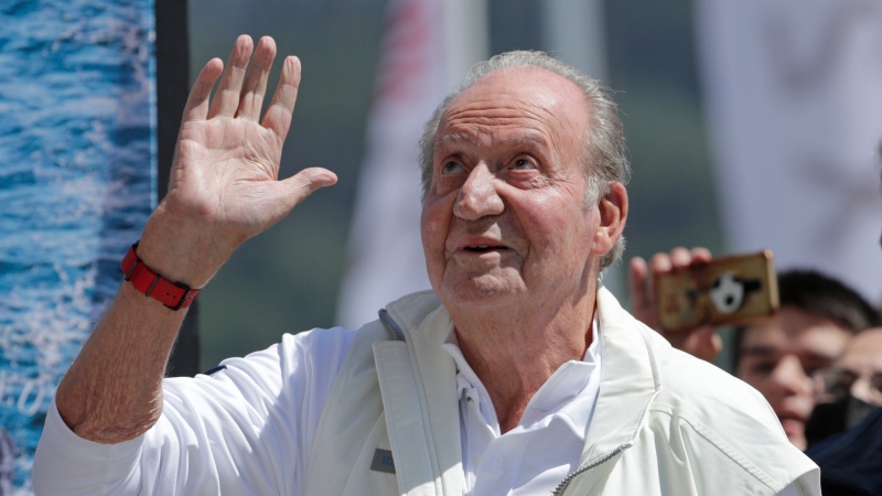Spain's former King Juan Carlos waves before a reception at a nautical club prior to a yachting event in Sanxenxo, north western Spain, Friday, May 20, 2022. (AP Photo/Lalo R. Villar)
