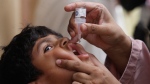 A health worker gives a polio vaccine to a child in Karachi, Pakistan, Monday, May 23, 2022. (AP Photo/Fareed Khan)
