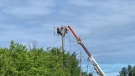 Hydro crews working on power lines in Ottawa. Hydro Ottawa says all available crews and external contractors have been called in to assist restoration efforts. May 23, 2022. (Shaun Vardon/CTV News Ottawa)