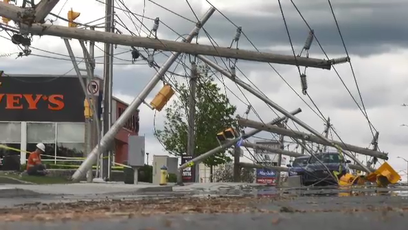 Hydro crews work to cleanup the damage and restore power along Merivale Road on Monday. (Leah Larocque/CTV News Ottawa)