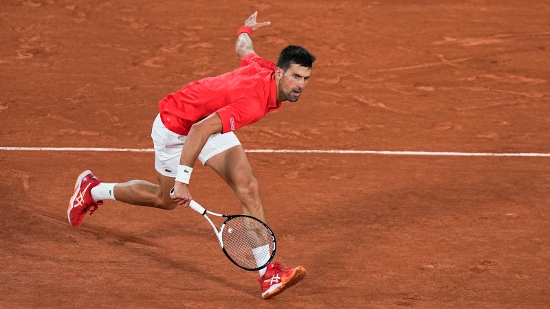 Serbia's Novak Djokovic plays a shot against Japan's Yoshihito Nishioka during their first round match at the French Open tennis tournament in Roland Garros stadium in Paris, France, Monday, May 23, 2022. (AP Photo/Michel Euler)