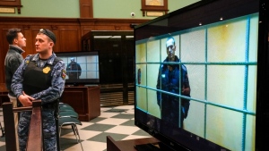 Alexei Navalny appears on a screen in the Moscow City Court, on May 24, 2022.  (Alexander Zemlianichenko / AP) 