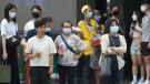 People wear face masks to help protect against the spread of the coronavirus in Taipei, Taiwan on April 28, 2022. (AP Photo/Chiang Ying-ying)