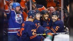 Edmonton Oilers winger Evander Kane, second right, celebrates his goal with teammates during second period NHL second round playoff hockey action against the Calgary Flames in Edmonton, Sunday, May 22, 2022. (THE CANADIAN PRESS/Jeff McIntosh)