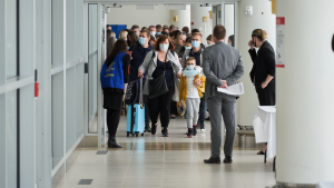 Ukrainian nationals fleeing the ongoing Russian invasion of Ukraine arrive at the Richardson International Airport, in Winnipeg, Monday, May 23, 2022. THE CANADIAN PRESS/David Lipnowski