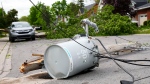 Hydro infrastructure and trees sit broken on a street in the Ottawa Valley municipality of Carleton Place, Ont. on Monday, May 23, 2022. A major storm hit the parts of Ontario and Quebec on Saturday, May 21, 2022, leaving extensive damage to infrastructure. (Sean Kilpatrick/THE CANADIAN PRESS)