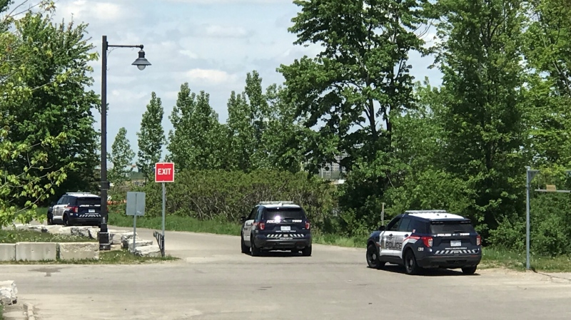 Police vehicles are seen at McLennan Park in Kitchener on May 24, 2022. 