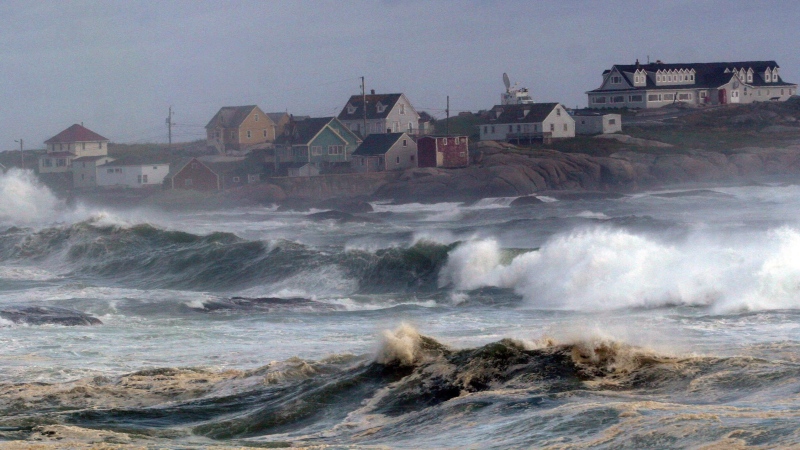 Waves crash on the beach at Peggy's Cove, N.S. Sunday August 23, 2009. THE CANADIAN PRESS/Tim Krochak 