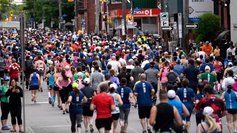 Runners begin the Ottawa Half Marathon along Ottawa's Elgin Street on Sunday, May 27, 2018. (Justin Tang/THE CANADIAN PRESS)