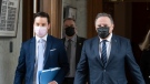 FILE: Quebec Premier Francois Legault, right, and Quebec Justice Minister Simon Jolin-Barrette, responsible for language law, walk to a news conference after tabling a reform on language law, Thursday, May 13, 2021 at the legislature in Quebec City. THE CANADIAN PRESS/Jacques Boissinot