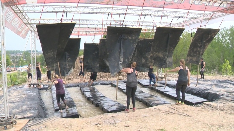 Participants navigate an obstacle during a Rugged Maniac event in Kitchener in 2019. (CTV Kitchener)
