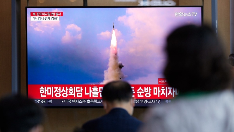 People watch a TV screen showing a news program reporting about North Korea's missile launch with file image, at a train station in Seoul, South Korea, May 25, 2022. (AP Photo/Lee Jin-man)