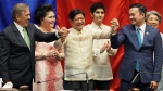 President-elect Ferdinand "Bong" Marcos Jr., centre, raises hands with Senate President Vicente Sotto III, left, and House Speaker Lord Allan Velasco during his proclamation at the House of Representatives in Quezon City, Philippines on May 25, 2022. (AP Photo/Aaron Favila)
