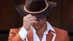 Matthew McConaughey adjusts his hat during an event in Austin, Texas, on April 19, 2022. (Jay Janner / Austin American-Statesman via AP) 