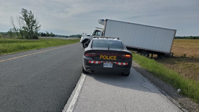 The 401 eastbound off ramp to Puce Road is partially blocked by a commercial motor vehicle in Lakeshore, Ont., on Wednesday, May 25, 2022. (Source:OPP)