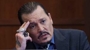 Johnny Depp testifies in the Fairfax County Circuit Courthouse, on May 25, 2022. (Evelyn Hockstein / Pool photo via AP) 