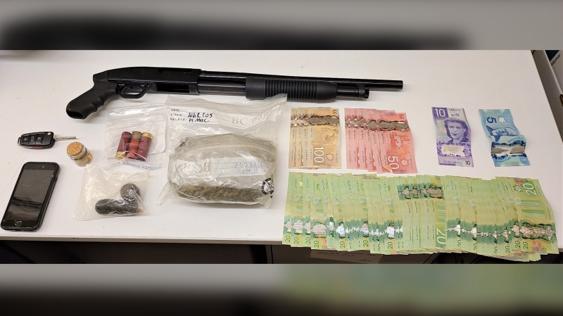 During a search, police seized over $2,000 cash, cannabis, hash, a 12-gauge shotgun and ammunition. (SOURCE: RCMP)