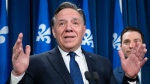 Quebec Premier Francois Legault responds to reporters questions after Bill 96, a legislation modifying Quebec's language law, was voted, Tuesday, May 24, 2022 at the legislature in Quebec City. THE CANADIAN PRESS/Jacques Boissinot