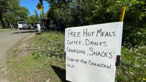 A tent and trailer offering up free hot meals to workers, volunteers and residents who have been without electricity since Saturday. (Peter Szperling/CTV News Ottawa)