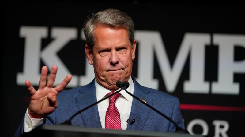 Republican Gov. Brian Kemp holds his fingers out denoting four more years in front of supporters during an election night watch party, May 24, 2022, in Atlanta. (AP Photo/John Bazemore)
