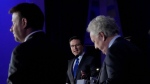 Candidates Roman Baber, left, Pierre Poilievre and Jean Charest, right, take part in the French language Conservative Leadership debate Wednesday, May 25, 2022 in Laval, Que..THE CANADIAN PRESS/Ryan Remiorz