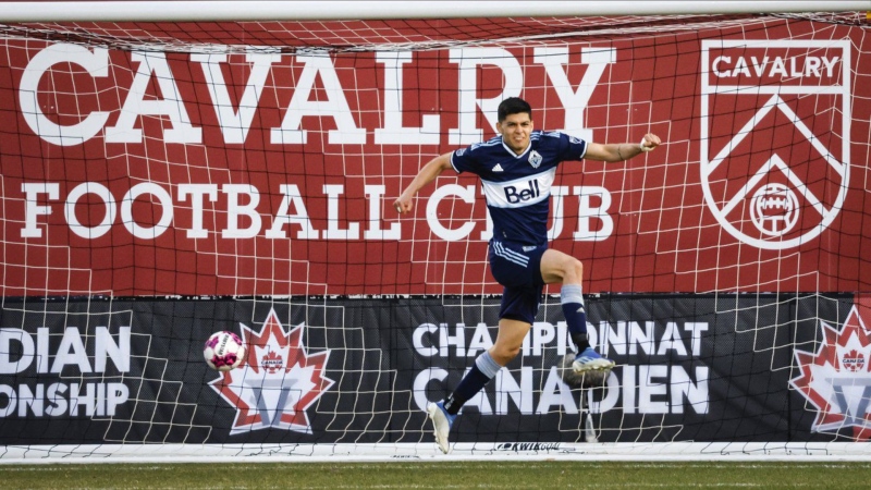 Vancouver Whitecaps defender Cristian Gutierrez celebrates his game-winning goal in a shoot out over the Calgary Cavalry during soccer action in the Canadian Championship quarter-finals in Calgary, Alta., Wednesday, May 25, 2022.(THE CANADIAN PRESS/Jeff McIntosh)