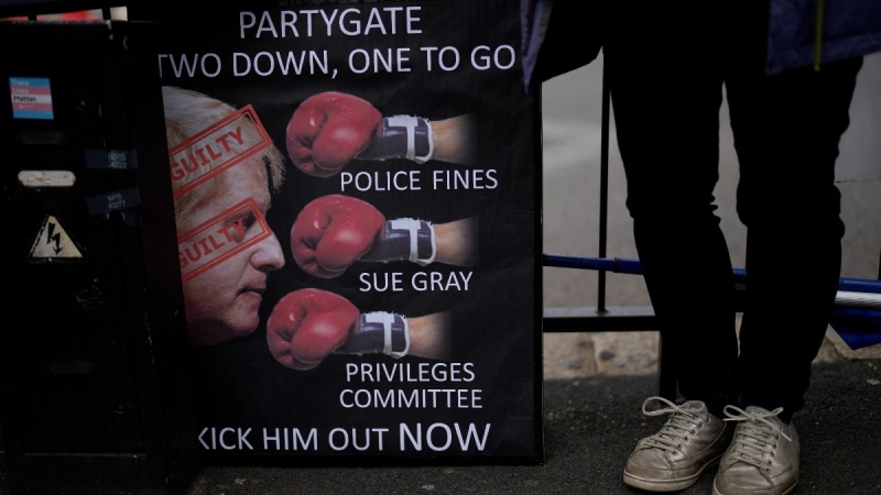 Protesting across the street from the Houses of Parliament in London, on May 25, 2022. (Matt Dunham / AP) 