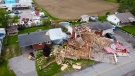 The debris from a building in an adjacent lumber yard is pictured in an image made using a drone in a neighbourhood in Hammond, Ont., on Thursday, May 26, 2022. A major storm hit parts of Ontario and Quebec on Saturday, May 21, 2022, killing 11 people and leaving extensive damage to infrastructure, homes, and business. (Sean Kilpatrick/THE CANADIAN PRESS)