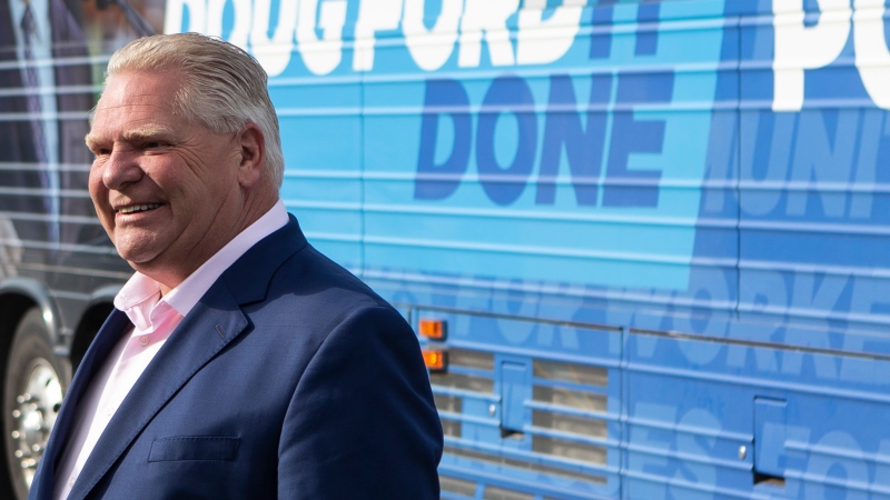 Ontario Premier Doug Ford steps off his campaign bus before making an announcement at the Alstom factory in Brampton, Ont., on Tuesday, May 24, 2022. THE CANADIAN PRESS/Chris Young