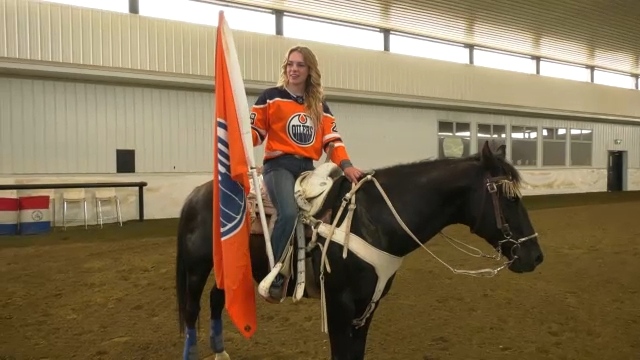 Bella Da Costa shows off her Oilers gear and trick riding partner Boon (CTV News Edmonton)