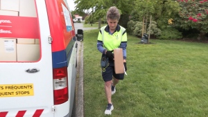 Canada Post delivery agent Leslie Black is pictured along her route in Oak Bay, B.C. (CTV News)
