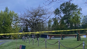Police blocked off a Surrey park after a man's body was found on May 26, 2022. 