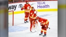 Calgary Flames, left to right, defenceman Rasmus Andersson, goalie Jacob Markstrom, and forward Matthew Tkachuk react after losing to the Edmonton Oilers in overtime in NHL second-round playoff hockey action in Calgary, Thursday, May 26, 2022. (THE CANADIAN PRESS/Jeff McIntosh)