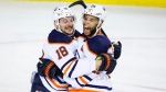 Edmonton Oilers winger Zach Hyman, left, celebrates his goal with teammate defenceman Darnell Nurse during second period NHL second-round playoff hockey action against the Calgary Flames in Calgary, Thursday, May 26, 2022.THE CANADIAN PRESS/Jeff McIntosh