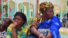 Relatives sit outside the Abdoul Aziz Sy Dabakh Hospital in Tivaouane, Senegal, on May 26, 2022. (Cheik Sy / AP)