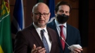 Public Safety Minister Marco Mendicino looks on as Justice Minister and Attorney General of Canada David Lametti speaks during a news conference, Wednesday, February 16, 2022 in Ottawa. THE CANADIAN PRESS/Adrian Wyld