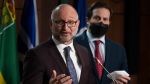 Public Safety Minister Marco Mendicino looks on as Justice Minister and Attorney General of Canada David Lametti speaks during a news conference, Wednesday, February 16, 2022 in Ottawa. THE CANADIAN PRESS/Adrian Wyld