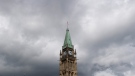 Storm clouds pass by the Peace tower and Parliament Hill in Ottawa, on August 18, 2020. (Adrian Wyld / THE CANADIAN PRESS)