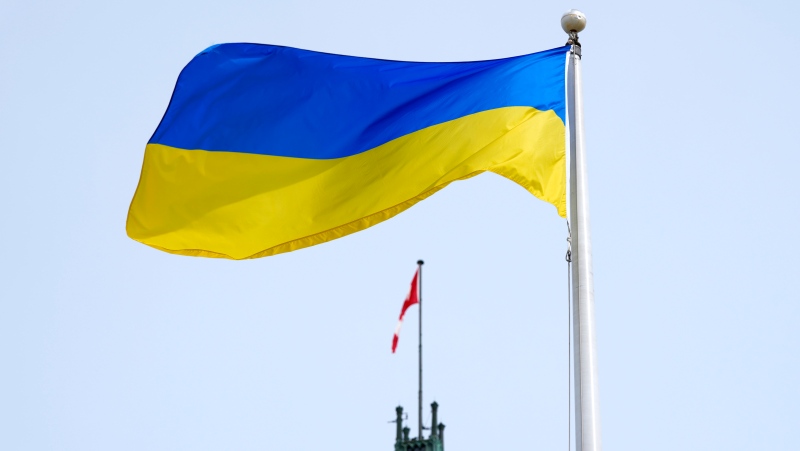 The flag of Ukraine is seen beside the Peace Tower, on the same day as Ukrainian President Volodymyr Zelenskyy’s address to Parliament in the House of Commons on Parliament Hill in Ottawa, on Tuesday, March 15, 2022. THE CANADIAN PRESS/Justin Tang
